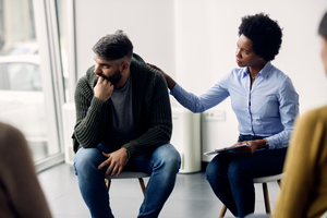 Woman supporting man who is talking about his vulnerability