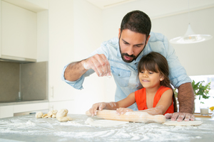 Daughter and Father spending quality time by cooking