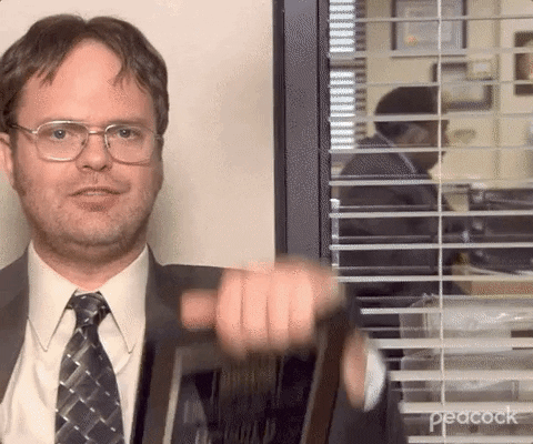 Rainn Wilson showing employee of the month awards