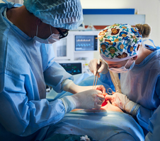 Medical team performing major procedure named abdominoplasty