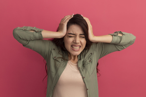 Indian woman with PCOD suffering with frequent headaches